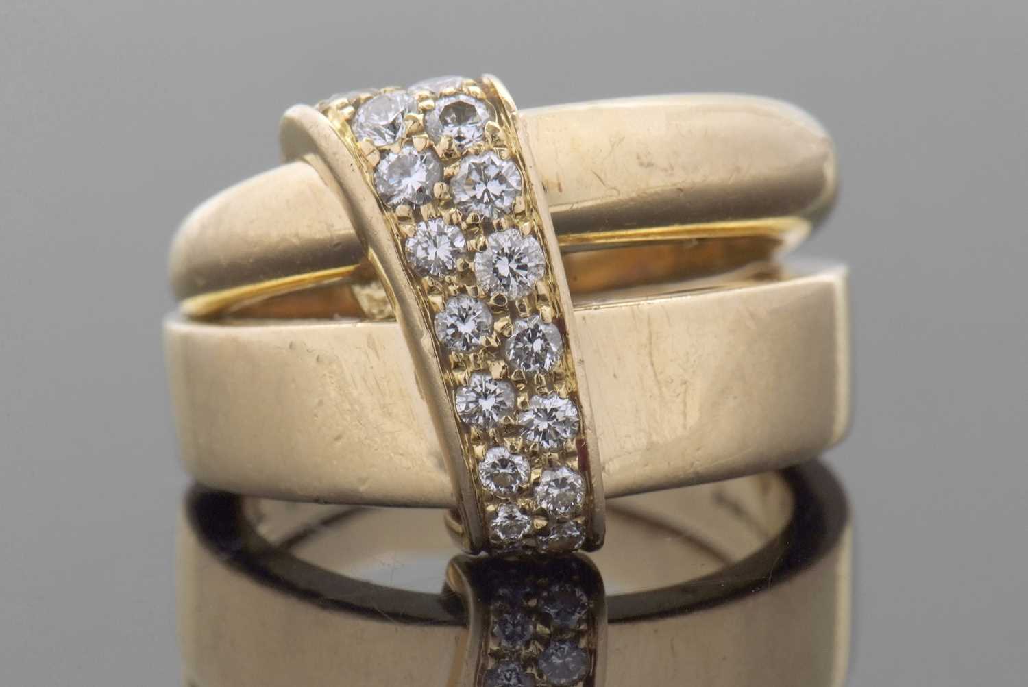 Lot 363 - An Asprey 18ct and diamond ring, the double...