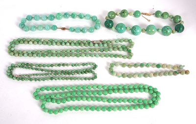 Lot 157 - A quantity of jade and similar green bead...