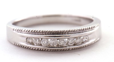 Lot 5 - A 9ct white gold and diamond ring, the upper...