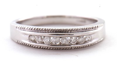 Lot 5 - A 9ct white gold and diamond ring, the upper...