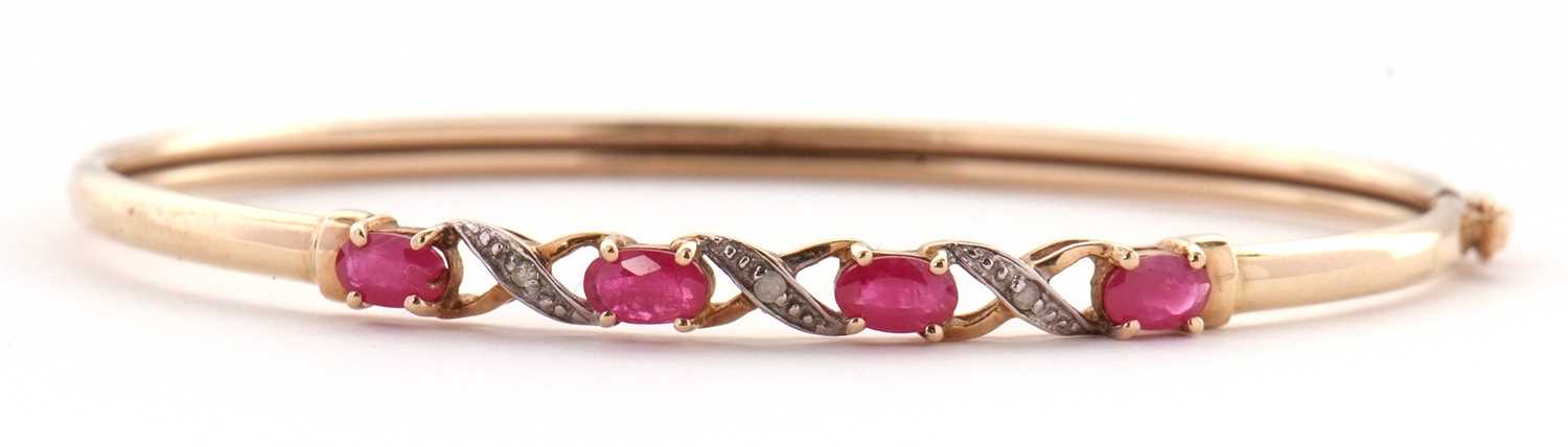Lot 55 - A 9k ruby and diamond bangle, the upper...