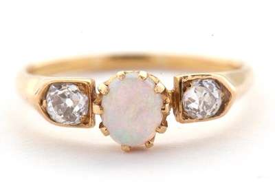 Lot 31 - An opal and diamond ring, the central claw...