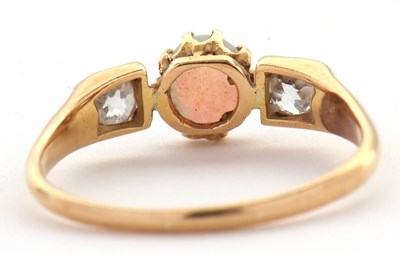 Lot 31 - An opal and diamond ring, the central claw...