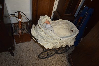 Lot 304 - METAL FRAMED DOLLS COT AND DOLL