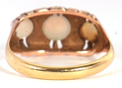 Lot 11 - A three stone opal ring, the three graduated...