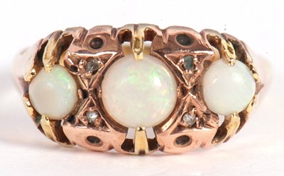 Lot 11 - A three stone opal ring, the three graduated...