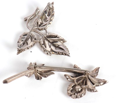 Lot 113 - Two brooches, the first modelled as an orchid...