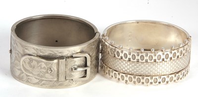 Lot 123 - A Victorian silver bangle and a buckle bangle,...