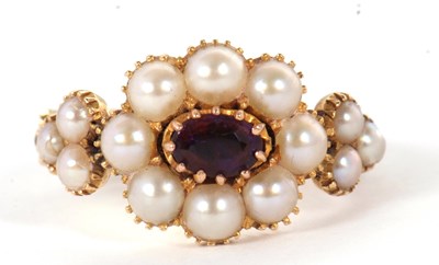 Lot 9 - A 19th century amethyst and pearl ring, the...