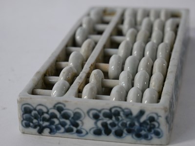 Lot 255 - Chinese porcelain abacus in rectangular frame...