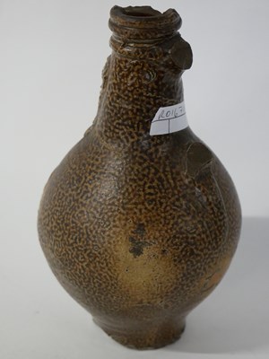 Lot 313 - 17th century tiger skin Belamine jug with...