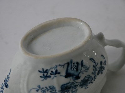 Lot 399 - Lowestoft porcelain cream jug decorated in...