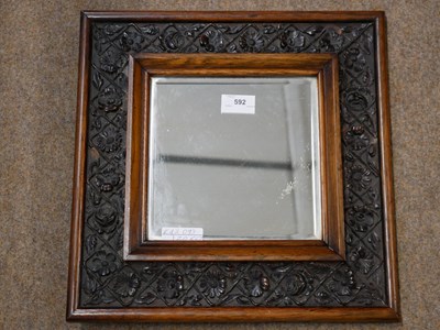 Lot 592 - Small 20th century square bevelled wall mirror...