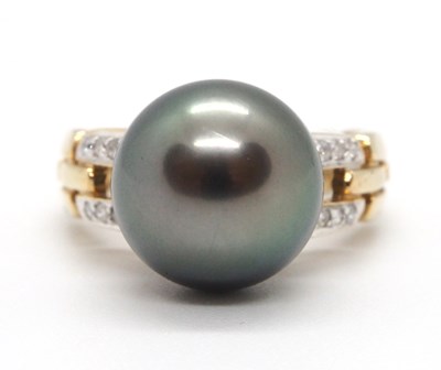 Lot 7 - A 9ct cultured pearl and diamond ring, the...