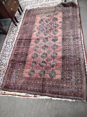 Lot 428 - 20th century Bokhara type floor rug with red...