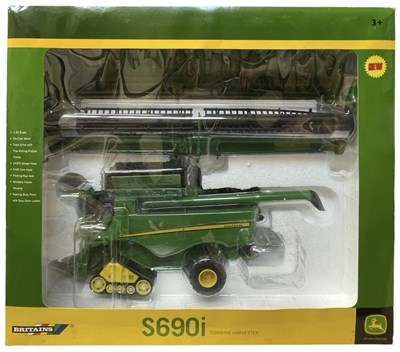 Lot 85 - A boxed Britains model combine harvester, a...