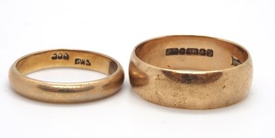 Lot 151 - Two gold rings: a 9ct gold wedding band 6.3mm...