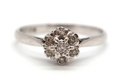 Lot 46 - An 18ct white gold cluster ring, comprised of...