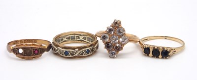 Lot 153 - Four gemset rings: to include a white stone...