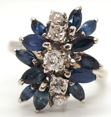 Lot 53 - An 18k sapphire and diamond ring, set with a...