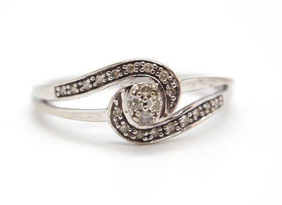 Lot 17 - A 9ct diamond ring, set to centre with four...