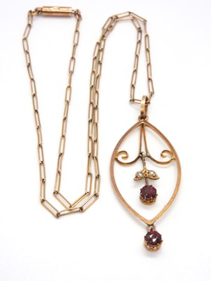 Lot 103 - An Edwardian garnet and seed pearl pendant and...