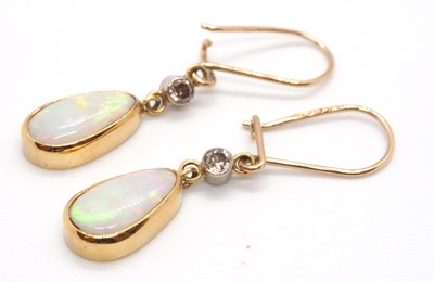 Lot 96 - A pair of opal and diamond earrings, the pear...