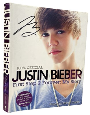 Lot 167a - A signed copy of Justin Bieber's 100% Official...