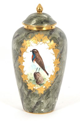 Lot 59 - A Coalport vase and cover, painted with birds...