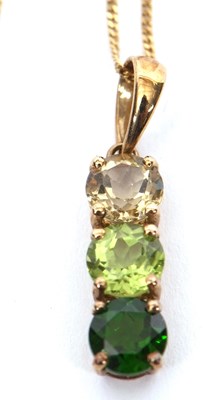 Lot 147 - A 9k three green stone pendant and chain, the...