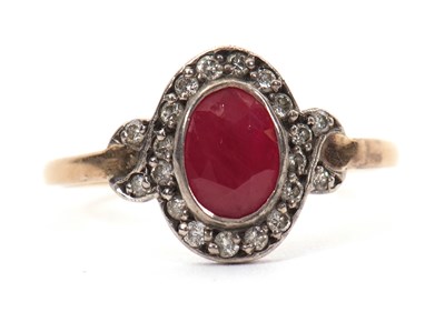 Lot 35 - A 15ct ruby and diamond ring, the oval mixed...