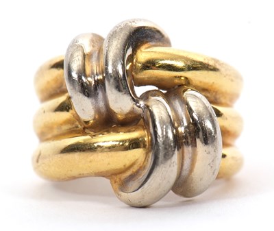 Lot 40 - An unmarked two tone ring, the two strand...