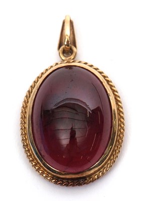 Lot 215 - A garnet pendant, the oval garnet cabochon in...