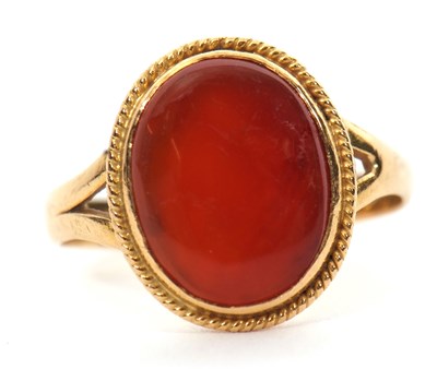 Lot 28 - An unmarked agate ring, the oval agate...