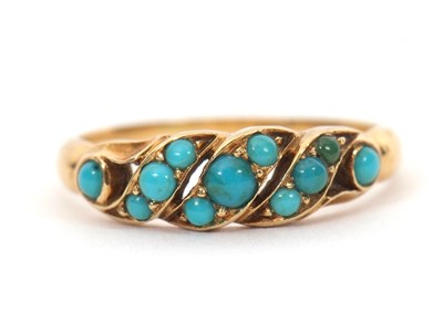 Lot 25 - An unmarked turquoise ring, set with small...