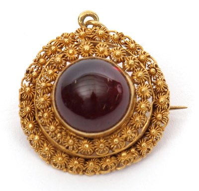 Lot 155 - A garnet cannetille pendant/brooch, the round...