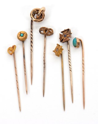 Lot 242 - Seven various stick pins, to include a knotted...