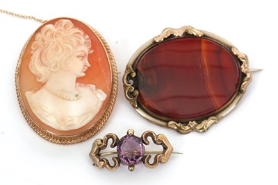 Lot 238 - Three brooches: to include a 9ct oval shell...