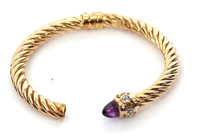 Lot 248 - A 9ct hinged bangle, the twisted torque style...