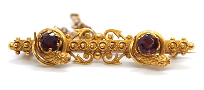 Lot 102 - An early 20th century 15ct garnet brooch, the...