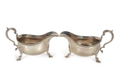 Lot 252 - A pair of George V silver sauce boats of...