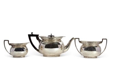 Lot 255 - A George V silver tea set of compressed oval...