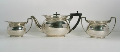 Lot 255 - A George V silver tea set of compressed oval...