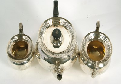 Lot 255 - A George V silver tea set of compressed oval...