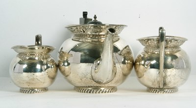 Lot 255 - A George V silver tea set of compressed oval...