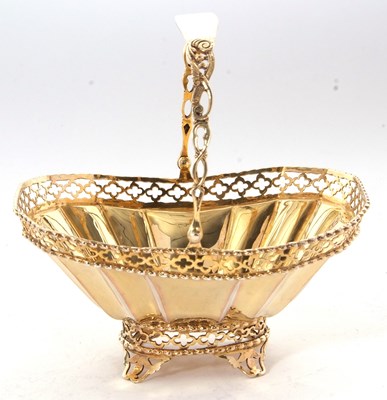 Lot 260 - A George V silver-gilt bonbon basket having a...