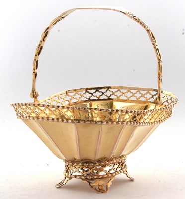 Lot 260 - A George V silver-gilt bonbon basket having a...