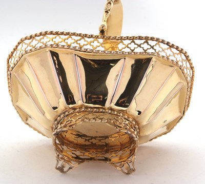 Lot 260 - A George V silver-gilt bonbon basket having a...