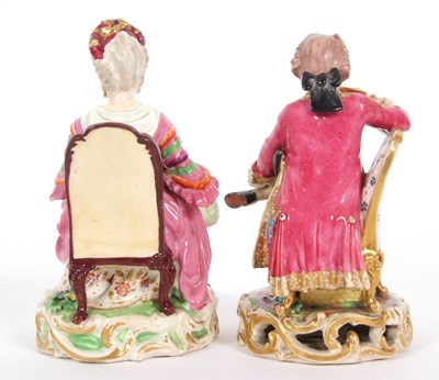 Lot 16 - A pair of Derby figures both seated on chairs...