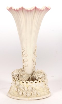 Lot 24 - A Belleek trumpet shaped vase the base with...